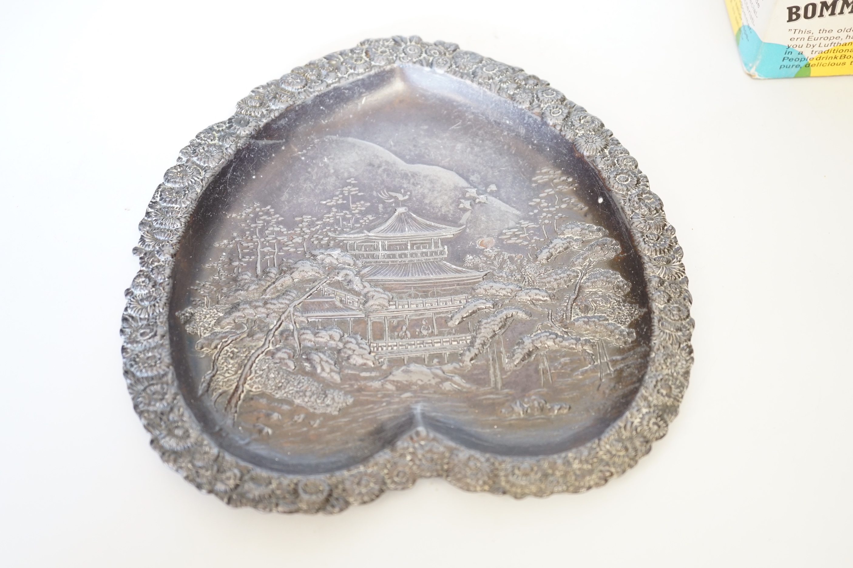 A silver-mounted ‘Whiskey’ decanter, 31cm, a boxed Lufthansa Bommerlunder, and a cast chinoiserie dish